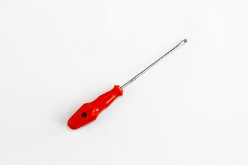 old rusty metal screwdriver for screws with red handle