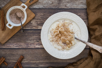 rice pudding on a wooden table, flat lay , seen from above