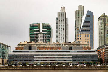 Modern residential and office buildings facing the river