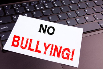 No Bullying writing text made in the office close-up on laptop computer keyboard. Business concept...