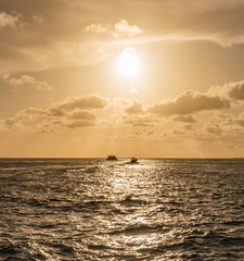 Sunset over the sea from a house and swimming pool