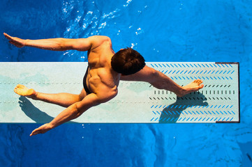 Diver from a unique perspective. The athlete is captured from the top camera view during practice.