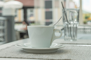 cup with coffee on the table