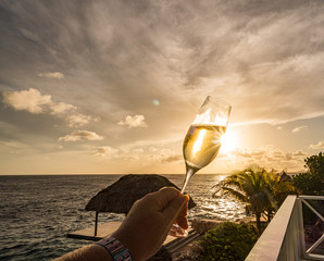 Sunset over the sea from a house and swimming pool