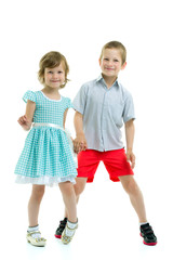 Brother and sister, boy and girl posing in the studio. Friendshi