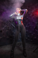 Obraz na płótnie Canvas futuristic Space fashion person in silver stylish outfit in the smoke
