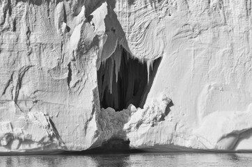 Inner Ice Cave with Teeth inside Iceberg in Antarctica in Black and White