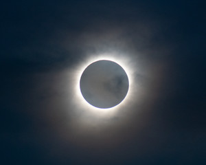 solare eclipse totality with some clouds