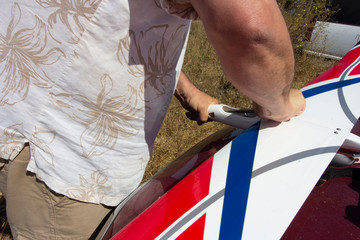 Repairing the wing of a model plain. 