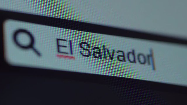 Browser bar with typed El Salvador keyword on the computer screen. Search Engine Concept. Shot in 4k resolution