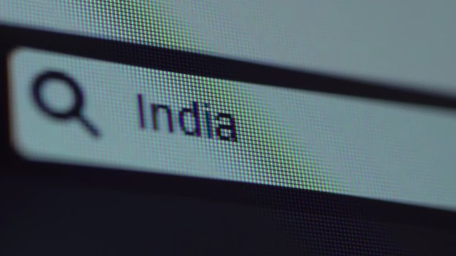 Browser bar with typed India text on the computer screen. Shot in 4k resolution
