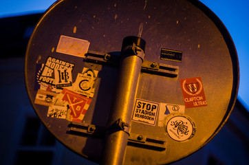 road sign with stickers