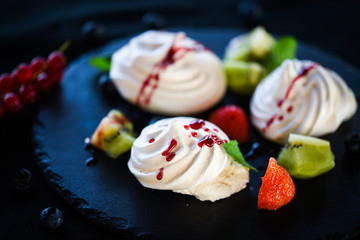 delicious pavlova sweet with fresh fruits
