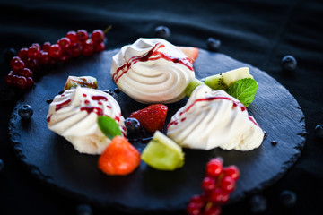 delicious pavlova sweet with fresh fruits