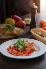 Cheese Salad and pepper, tomatoes, cheese, pita on the table in the restaurant. Georgian traditional food