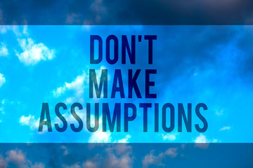Fototapeta premium Handwriting text Don t not Make Assumptions. Concept meaning putting plan in future with percentage happening Multiline text desktop natural blue sky cloudy background send messages