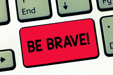 Text sign showing Be Brave. Conceptual photo ready to face and endure danger or pain showing courage Bold Keyboard key Intention to create computer message, pressing keypad idea