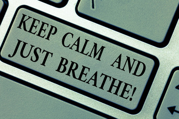 Writing note showing Keep Calm And Just Breathe. Business photo showcasing Take a break to overcome everyday difficulties Keyboard key Intention to create computer message pressing keypad idea