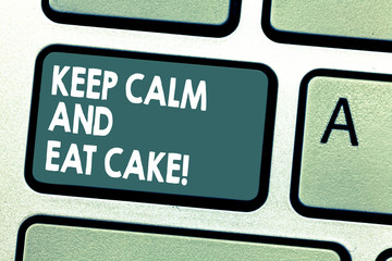 Fototapeta premium Conceptual hand writing showing Keep Calm And Eat Cake. Business photo showcasing Relax and enjoy eating a sweet food dessert Keyboard key Intention to create computer message idea