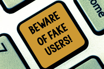 Fototapeta premium Text sign showing Beware Of Fake Users. Conceptual photo Be aware of safety and danger in online communications Keyboard key Intention to create computer message pressing keypad idea