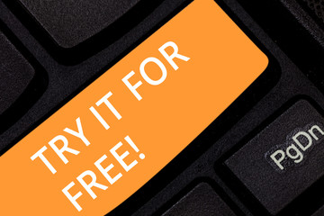 Writing note showing Try It For Free. Business photo showcasing Trial at not any cost Offer promotion big discount Keyboard key Intention to create computer message pressing keypad idea