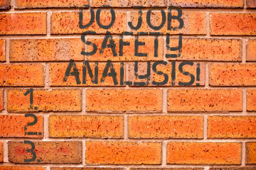 Fototapeta na wymiar Conceptual hand writing showing Do Job Safety Analysis. Business photo showcasing Business company security analytics control