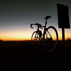 Fototapeta na wymiar silhouette of bicycle on sunset