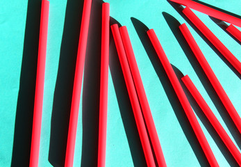 Mixed vivid color of straw stick . Blue background