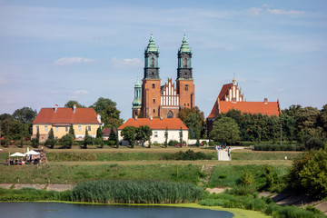Naklejka premium The landscape with the centuries old red brick building of Cathedral of Saint Peter and Paul in Poznan, Poland