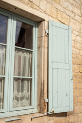 old window with wooden shutters