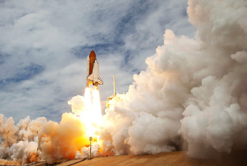 The launch of the space shuttle. With fire and smoke. Against the background of the starry sky. ...