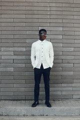 Obraz premium Handsome black man in a city. Businessman in a white shirt