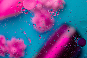 Micro molecular abstract pattern of colored oil bubbles on water. 