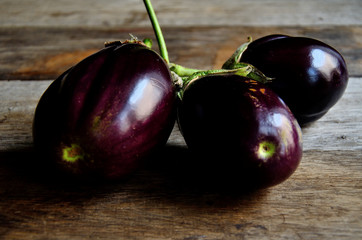 Eggplant with a home garden on a rustic table.