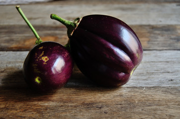 Eggplant with a home garden on a rustic table.