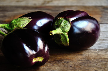 Eggplant with a home garden on a rustic table.