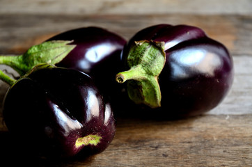 Eggplant with a home garden on a rustic table.