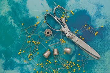 spools scissors thimble and pins 
