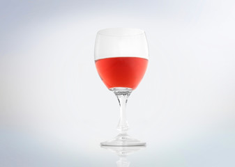 Rosé wine in a glass isolated on white background .