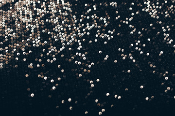 Textures of black women's dress with sequins