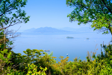 Fototapeta na wymiar Inland sea near Hiroshima with boats and vegetation