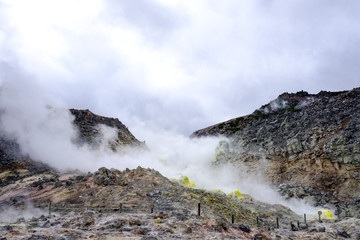 Fototapeta na wymiar Iozan hissing mountains in Hokkaido, with sulphur and smoke