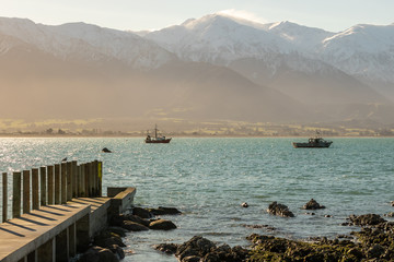 Boat in Kaikoura Harbor, New Zealand Sunset Background 