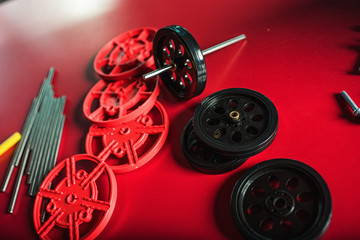 gears and wheels on red