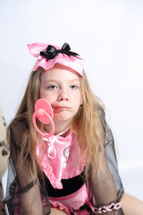 little girl fashionista in her mother's big pink