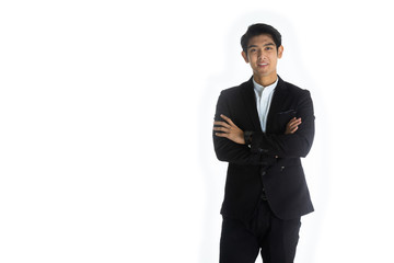 Obraz na płótnie Canvas Handsome young businessman Asian caucasian wear a black suit with black hair, be a smile and standing poses by crossed his arm. On white background