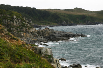 Fototapeta na wymiar Rocky seashore during a small storm