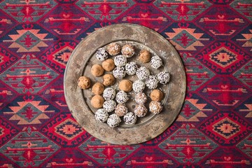 Sweet protein energy balls with almonds, dates, chocolate, coconut. Vegan dessert.