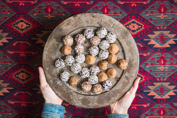 Sweet protein energy balls with almonds, dates, chocolate, coconut. Vegan dessert.