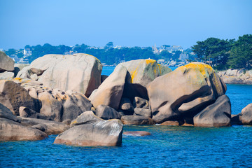Seascape with huge pink granite boulders near Plumanach. The coast of pink granite is a unique place in Brittany. France